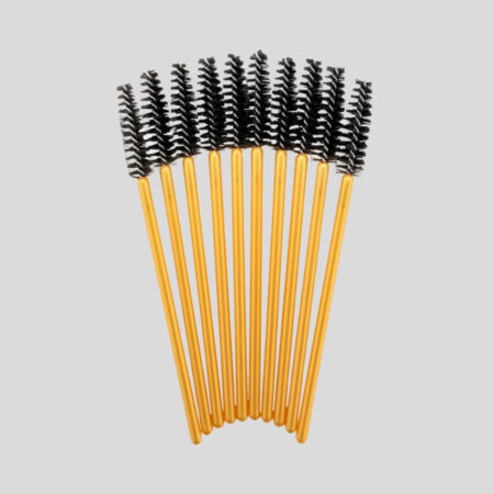 Gupillón dorado y negro ideal para el cuidado de extensiones de pestañas.